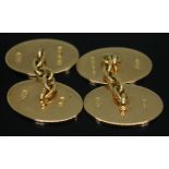 A pair of hallmarked 18ct gold cufflinks, wt. 13.08g.