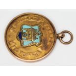 A hallmarked 9ct gold medal bearing Wigan crest, wt. 6.84g.