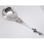 A Georg Jensen Sterling silver spoon number 49, scroll finial and hammered bowl, length 18.5cm.