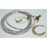 A mixed lot comprising a set of white metal bangles, a ring marked '9ct', an earring rings marked '