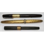 A group of three vintage fountain pens comprising a Waterman's 877, a Sheaffer's Australia and a