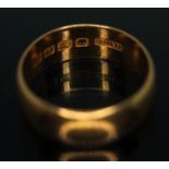 A hallmarked 22ct gold wedding band, wt. 11.69g, size K.