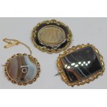 A group of three yellow metal brooches comprising a 19th century mourning brooch, one set with an
