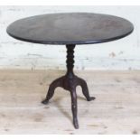A Georgian "Isle of Man" miniature tripod table with cast iron base formed as three legs and round