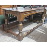 An oak refectory table and five chairs.