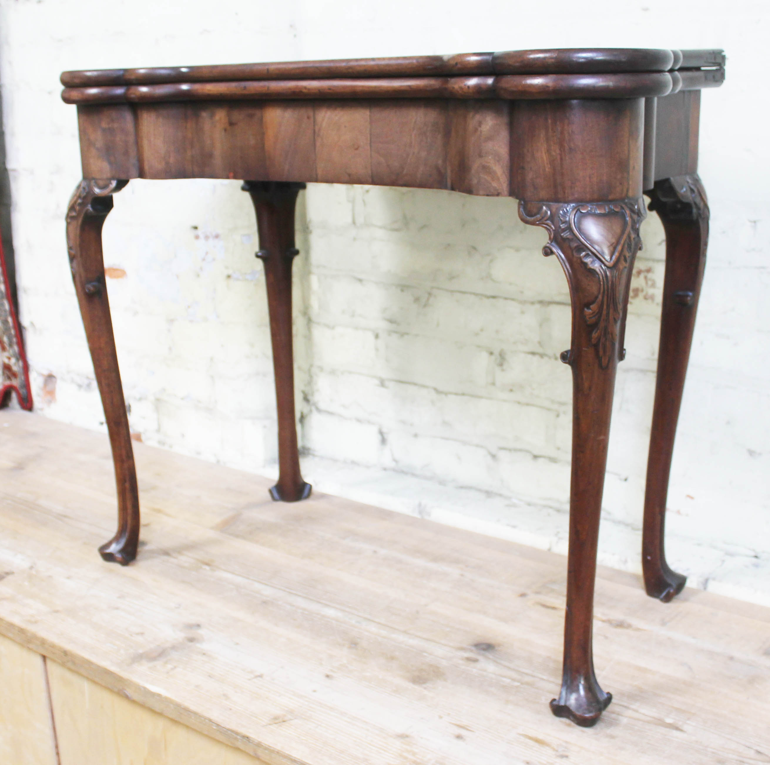 A George II mahogany games table, circa 1740, with fold-over top, the green baize lined interior - Image 2 of 14