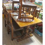 A Titchmarsh and Goodwin oak refectory table and six chairs.