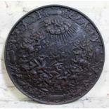 A large embossed metal plaque depicting god looking down over a battle, indistinct maker's mark