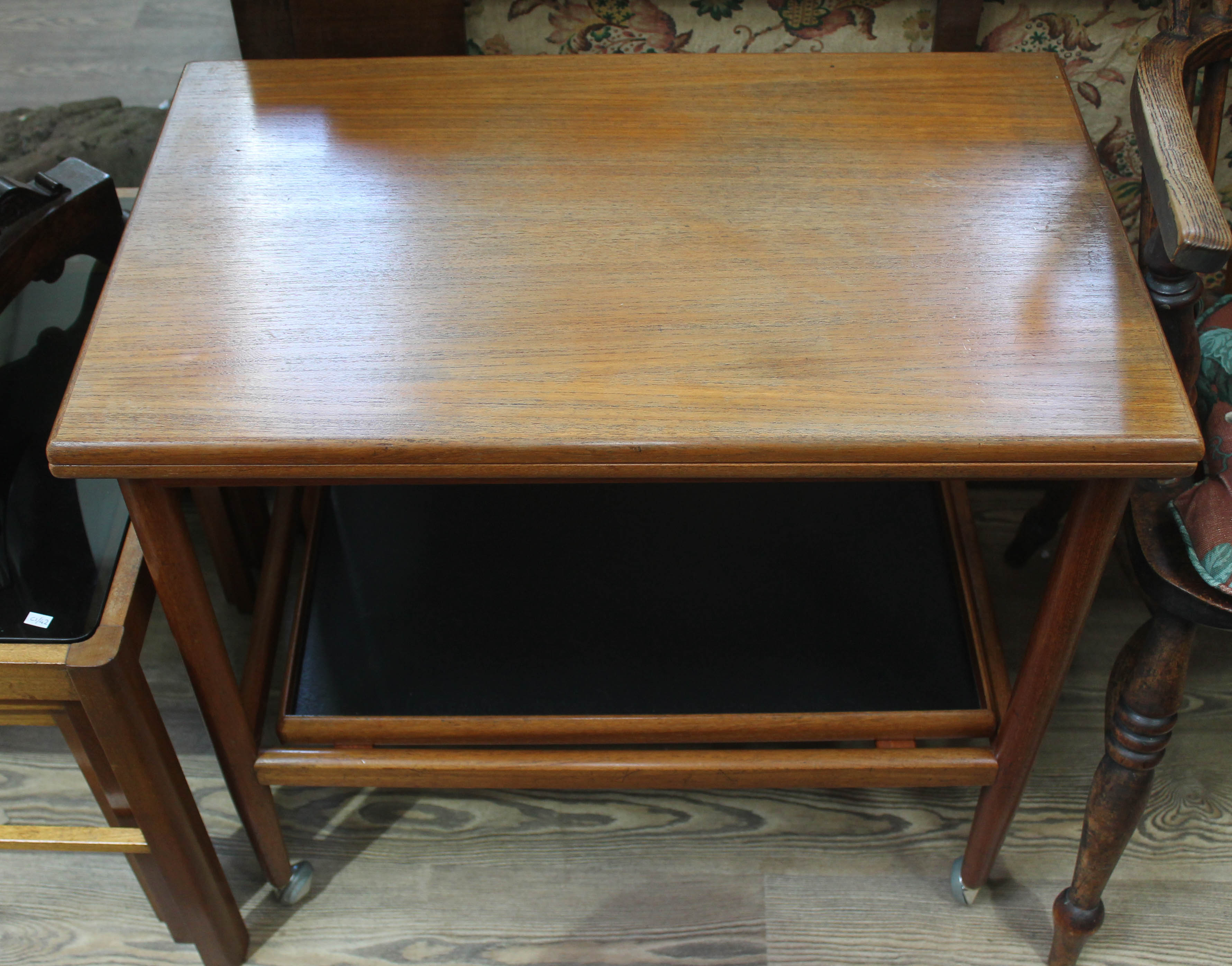 A Danish teak trolley.