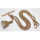 A hallmarked 9ct gold Albert Chain, length 39cm, with hallmarked T bar and yellow metal fob, gross