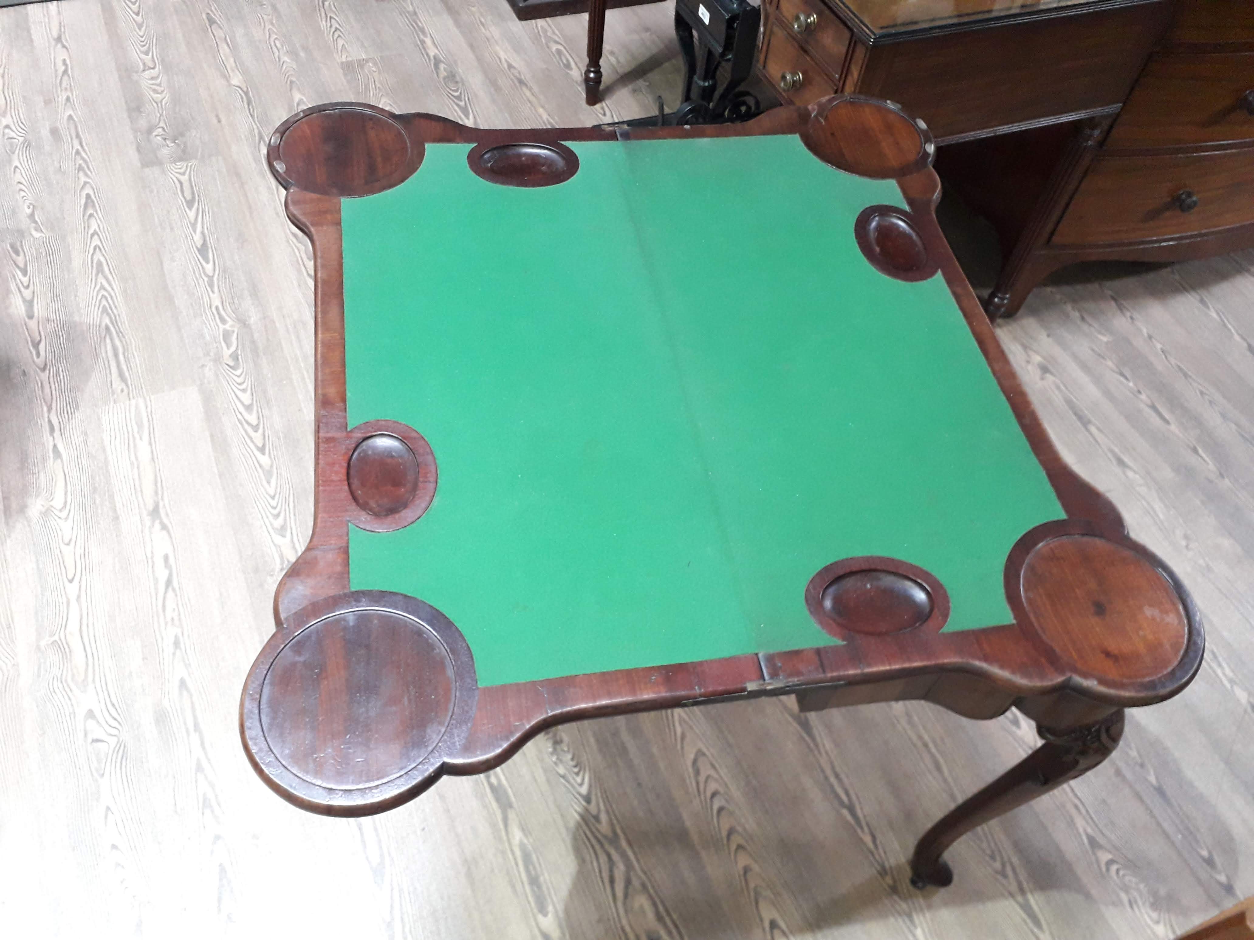 A George II mahogany games table, circa 1740, with fold-over top, the green baize lined interior - Image 7 of 14