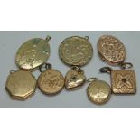 A group of eight yellow metal lockets.