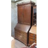 A Georgian Chippendale style mahogany cabinet bureau, width 112cm, depth 63cm & height 236cm.