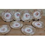A set of eight 19th century porcelain cabinet plates decorated with pheasants, butterflies and