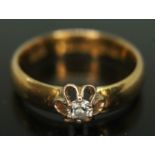 A hallmarked 22ct gold diamond solitaire ring, the round brilliant cut stone weighing approx. 0.10