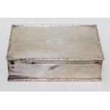 A George VI silver cigar box, textured exterior with floral moulded border, gilt interior, cedar