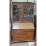 A George III mahogany bureau bookcase, width 111cm, depth 57cm & height 207cm.