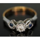 A hallmarked 18ct gold and platinum diamond and sapphire ring, gross wt. 2.81g, size L.