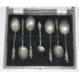 A cased set of hallmarked silver apostle spoons with shell bowls.