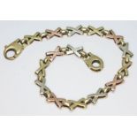 A hallmarked three colour 9ct gold bracelet, length19cm, wt. 9.03g.