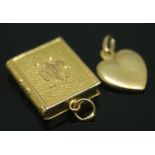 A heart shaped pendant marked '750' and another formed as a book unmarked, gross wt. 3.66g.
