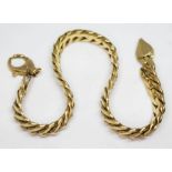 An Italian smooth link bracelet, length 21cm, marked '750', wt. 15.82g.