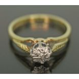 A hallmarked 18ct gold ring with single diamond in illusion setting, gross wt. 2.44g, size I.