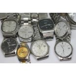 A collection of eight vintage Seiko SQ quartz stainless steel wristwatches al with day or day/date
