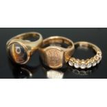 A group of three hallmarked 9ct gold rings comprising one set with a tiger's eye cabochon, a
