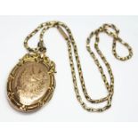 A yellow metal locket etched with a swallow and marked '9CT BKS & FTS', length 45mm, on chain marked
