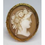 A Victorian yellow metal mounted shell cameo brooch with Greek key boarder, length 40mm, gross wt.