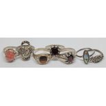 A group of seven rings comprising a hallmarked silver ring set with a rhodochrosite cabochon, six