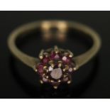 A hallmarked 9ct gold ruby cluster ring, head diam. approx. 7mm, gross wt. 1.93g, size N.