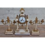 A French ormulu mounted marble clock garniture, clock height 42cm.