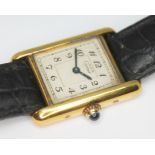 A Cartier Tank silver gilt wristwatch.