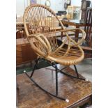 A retro rocking rattan armchair.