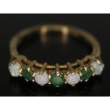 A hallmarked 9ct gold opal and emerald ring, gross wt. 1.86g, size M.