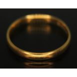 A hallmarked 22ct gold wedding band, wt. 1.72g, size I.