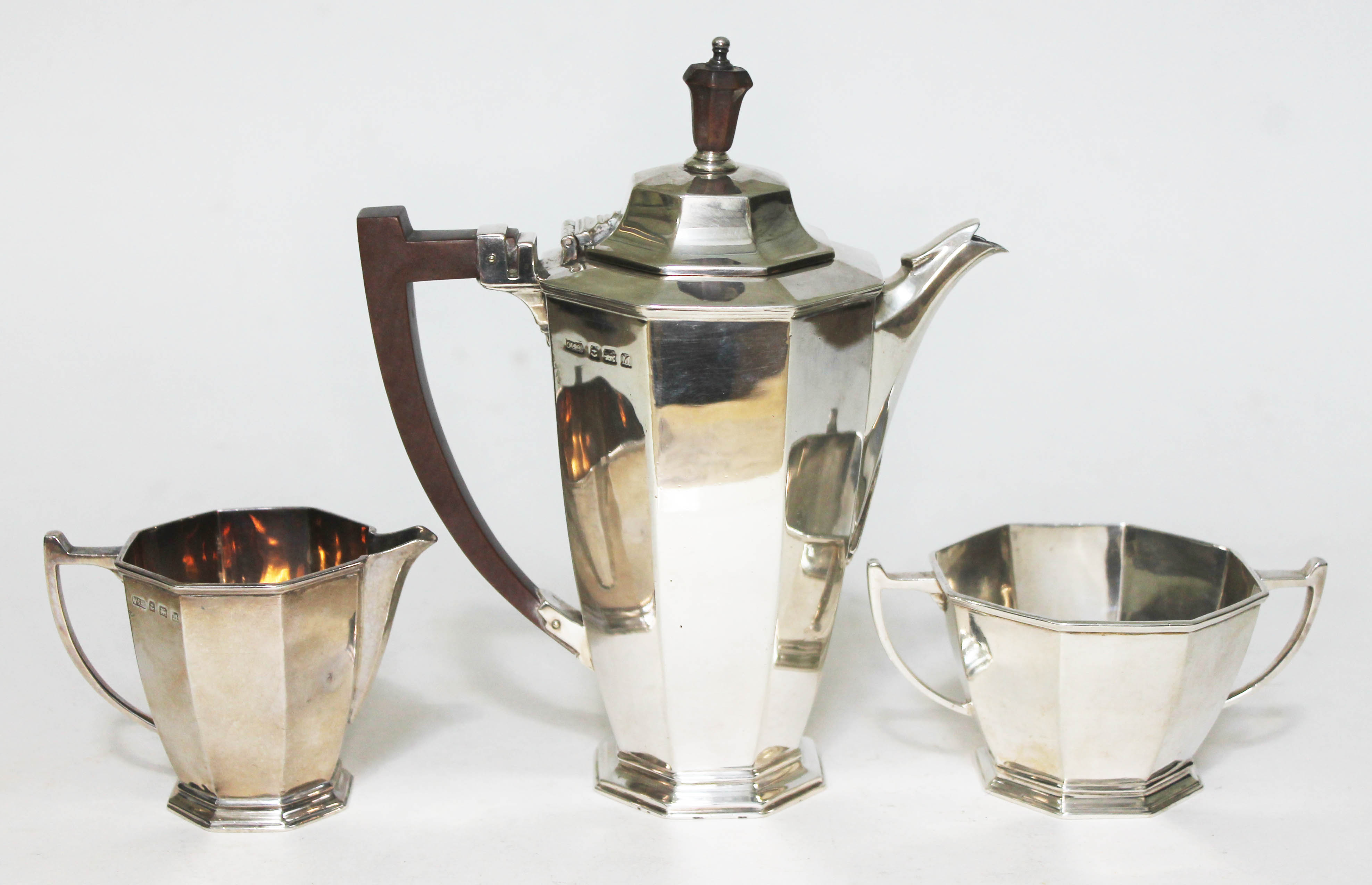 A three piece silver bachelors tea set comprising teapot, cream jug and sugar bowl, Ollivant &