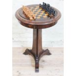 A 19th century rosewood games table with removable chess board top revealing sunken well, triform