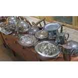 A quantity of silver plated ware including a champagne bucket, tureens, goblets etc.