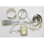 A mixed lot of silver comprising a ladle and two serviette rings, together with a silver plated