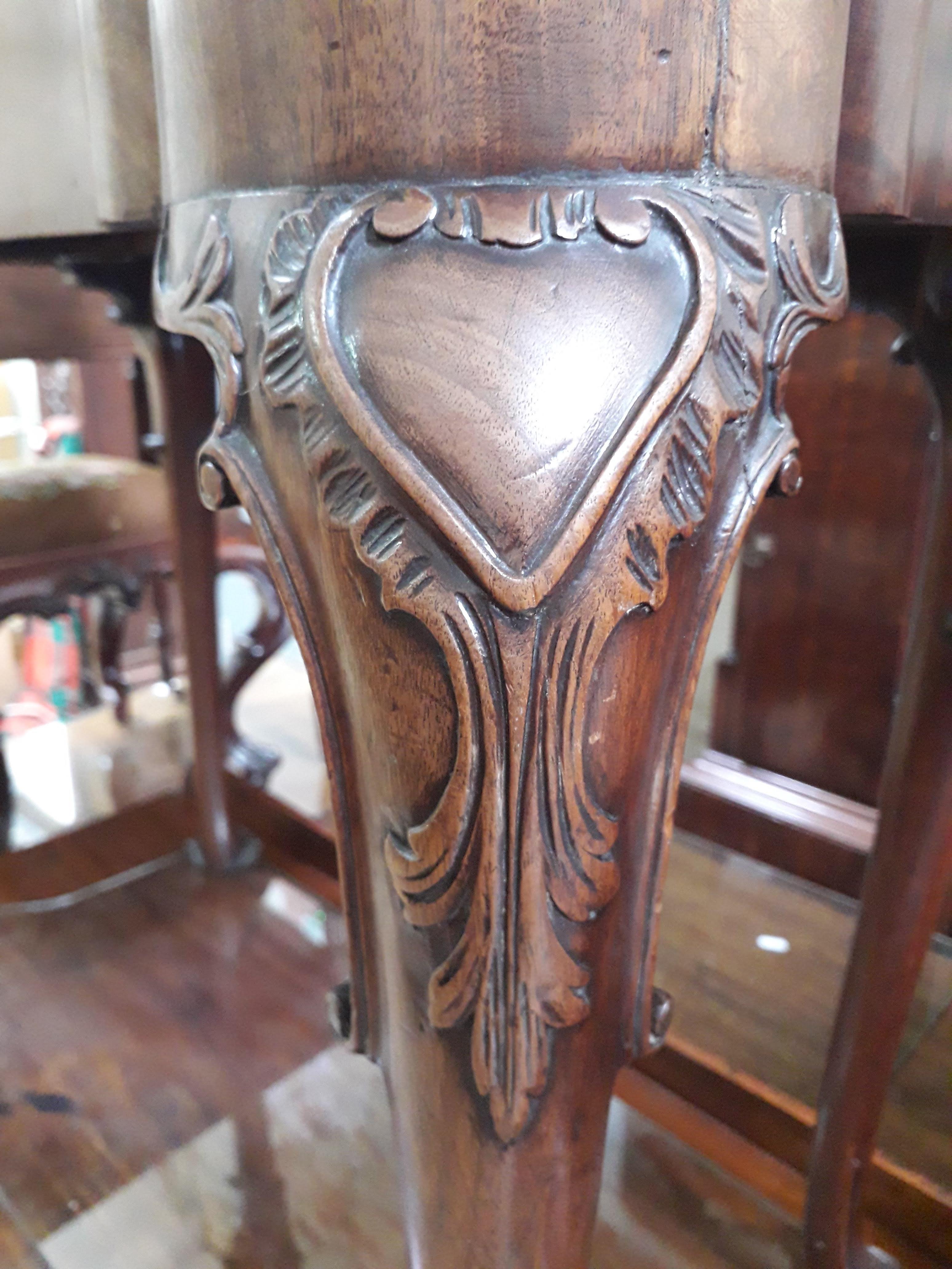 A George II mahogany games table, circa 1740, with fold-over top, the green baize lined interior - Image 13 of 14