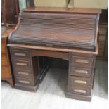 A roll top pedestal desk, width 121cm, depth 84cm & height 115cm.