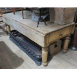 A Victorian two drawer pine kitchen table.