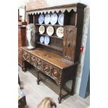 A 19th century geometric moulded oak dresser.