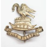 A Liverpool pals regimental cap badge, marked 'Sterling', maker's initials 'TLM'.