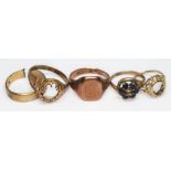 A group of four hallmarked 9ct gold rings and another marked '9ct gold', gross wt. 15.43g.