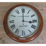 A round mahogany wall clock, the dial signed 'J.W. Morecambe', diam. 38.5cm.