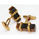 A pair of hallmarked 9ct gold cufflinks set with rectangular prism cut quartz tiger's eye, length